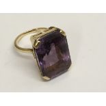 A 15ct gold ring set with a large square cut ameth