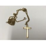 A 9ct gold cross and chain.