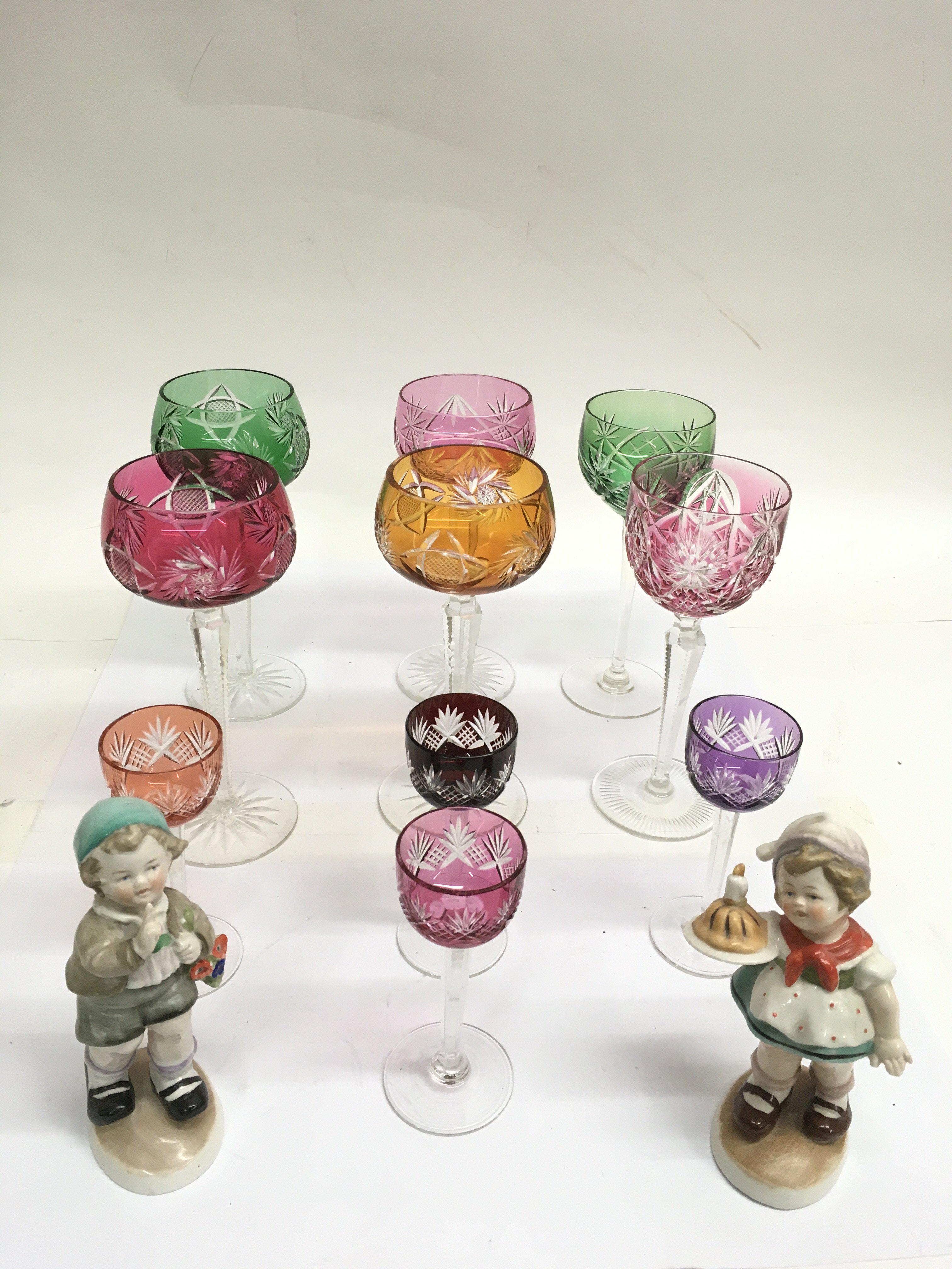 A group of Bohemian coloured glasses and pair of c