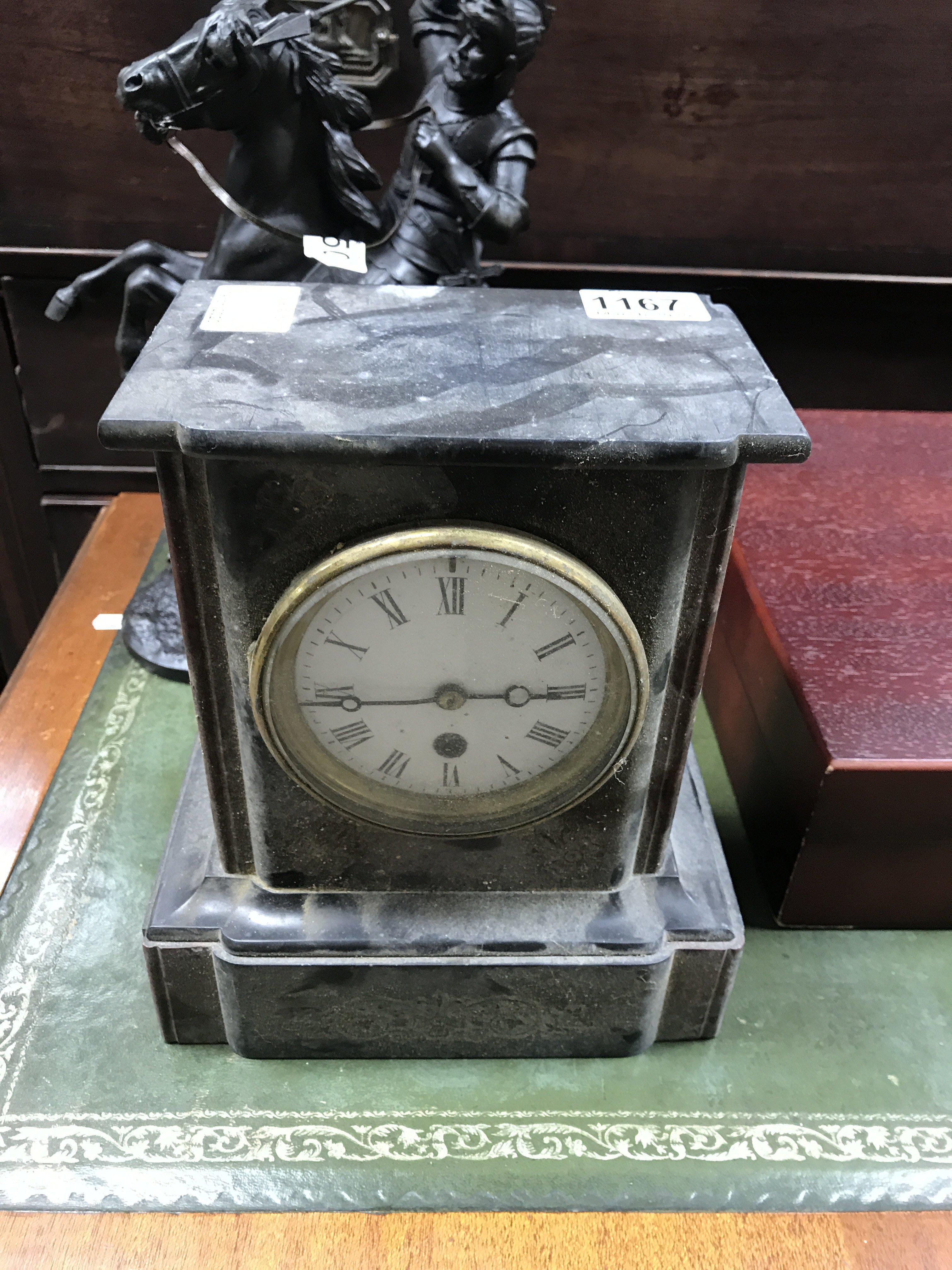 A small slate and marble mantle clock