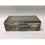 A silver cigarette box with engraved lid Sheffield