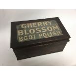 An old wooden box advertising cherry blossom boot