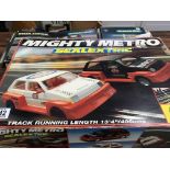 A Scalextric mighty Metro. Set and two other Scalextric sets.