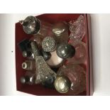 A collection of silver top perfume bottles and tid