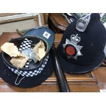 An Essex police officers helmet, cap, truncheon an