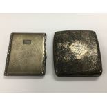 Two silver cigarette cases.