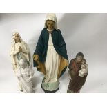 A collection of four religious plaster figures