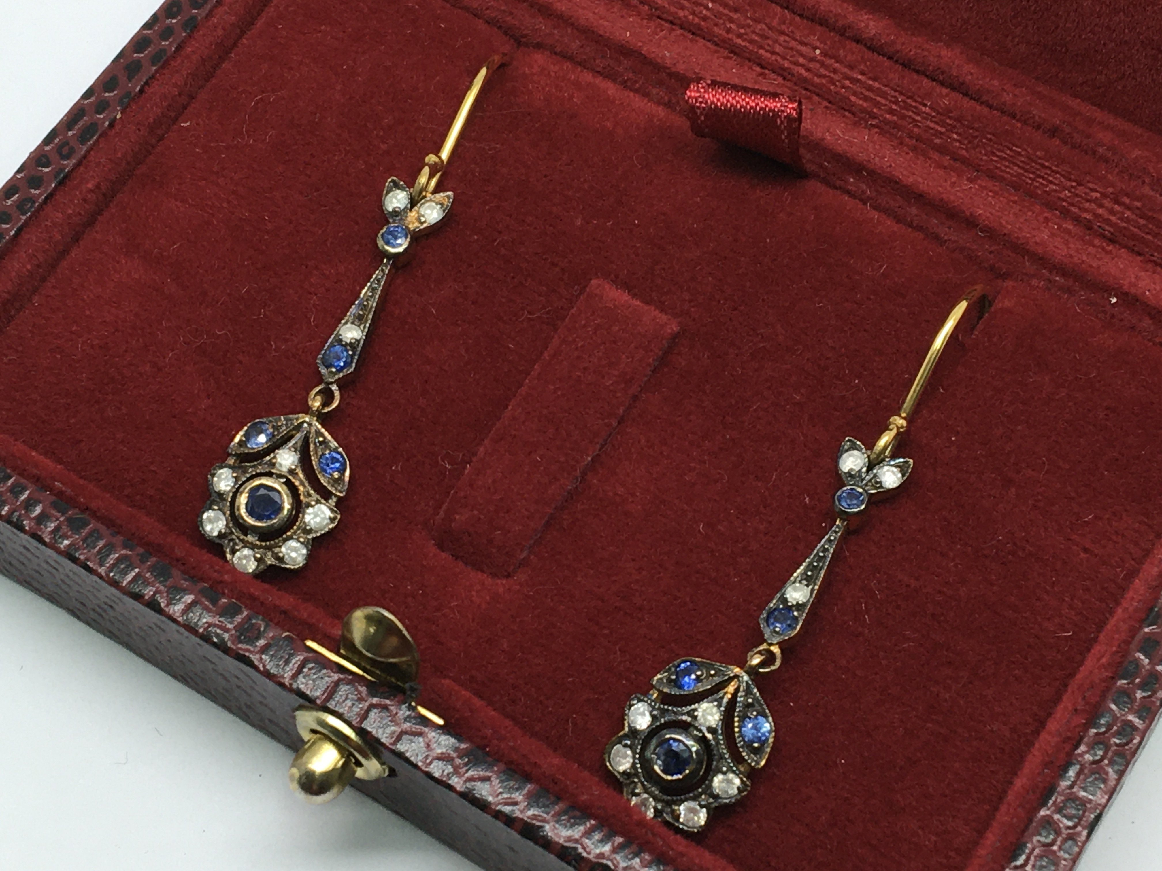 A pair of sapphire and diamond flower-style drop e