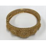 A heavy 22ct gold Indian bracelet, marked 22k. App