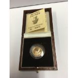 A Cased1987 Brittania 1/10oz proof 22ct gold coin.