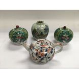 Four Oriental ceramic items comprising a small tea