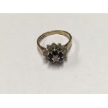 A 9ct gold sapphire and diamond set cluster ring.