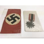 A 1939 German Third Reich iron cross and armband