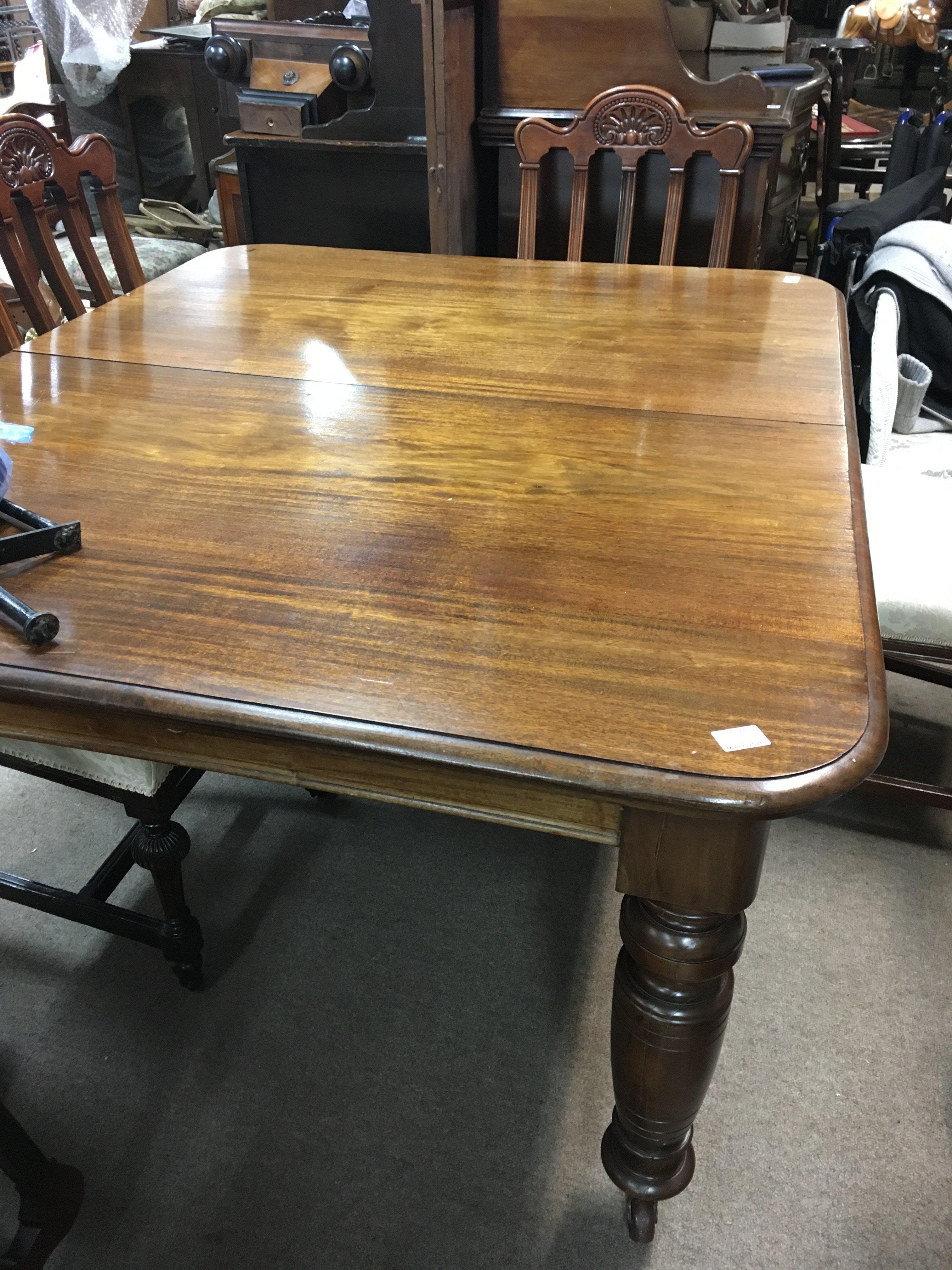 A large Victorian extending Wind out dining table
