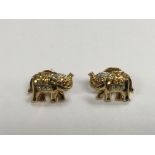 A pair of 18ct gold earrings in the form of elepha