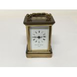 A miniature brass carriage clock the dial with the inscription Matthew Norman.
