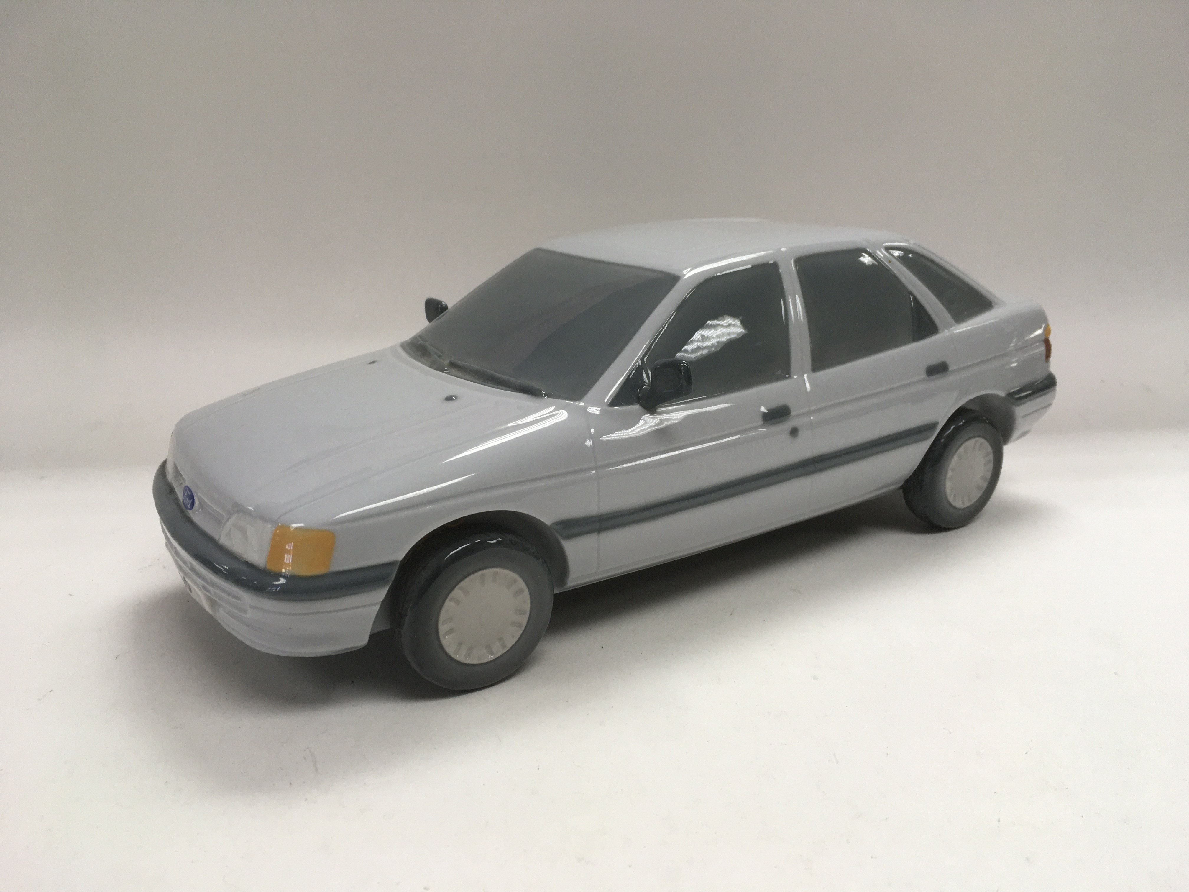 A Lladro model of a Ford Escort, approx length 29c