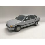 A Lladro model of a Ford Escort, approx length 29c