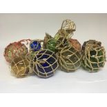 A collection old of blown glass coloured net fishi