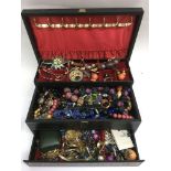 A large jewellery box of various costume jewellery