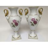 A pair of Empire Style Kaiser Porcelain vases with gilded swan neck scrolls the sides hand painted