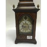 A Georgian style mantle clock the brass dial with chapter ring and Roman numerals Maker w