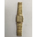 A gold tone ladies Omega watch with squared dial a