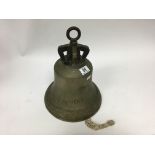 A bronze bell dated 1860, 35cm high.