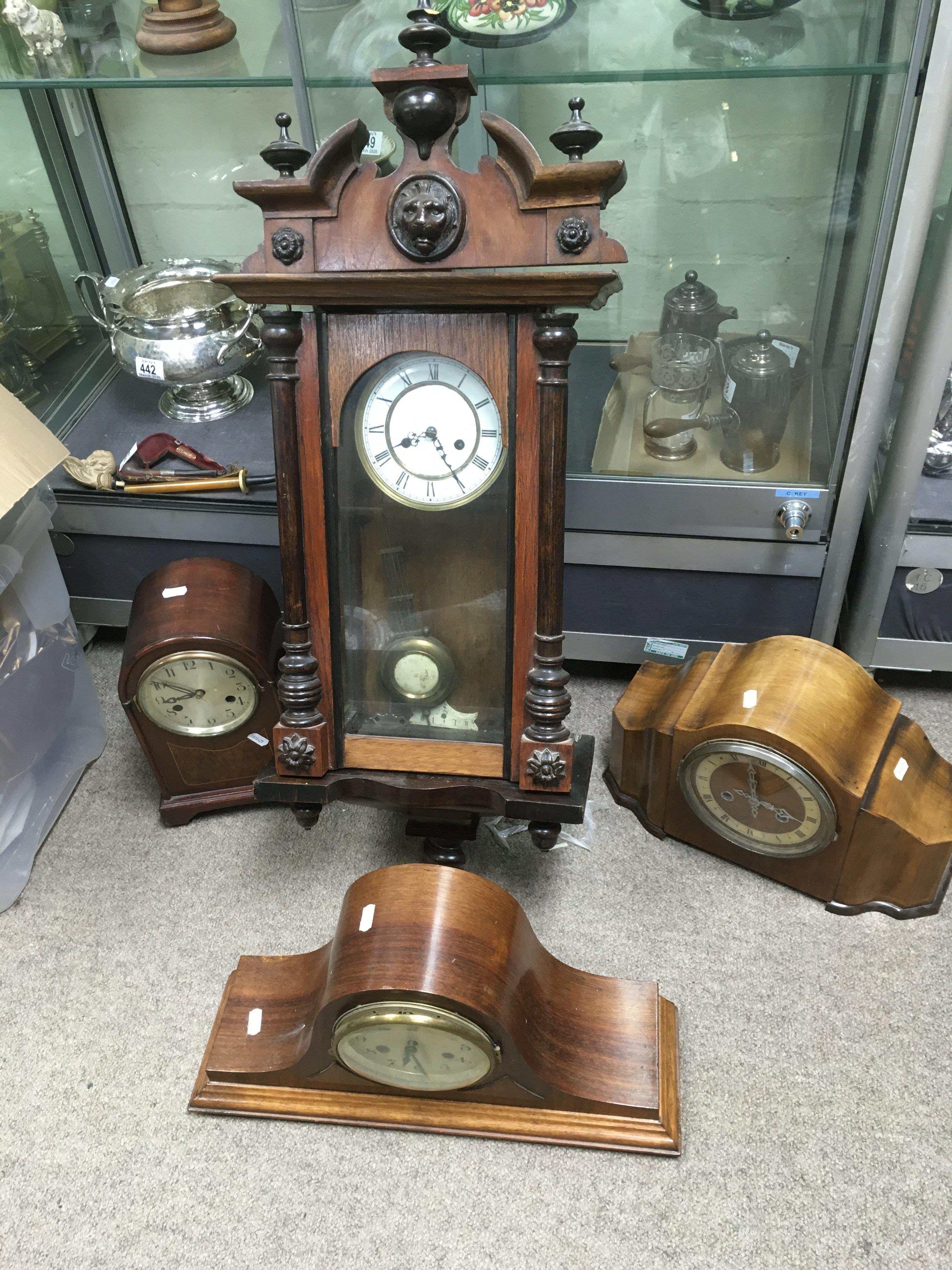 An eight day mahogany cased wall clock plus three