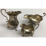 A silver cream jug and two sauce boats, approx 296