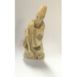 A 19th century carved Japanese netsuke in the form