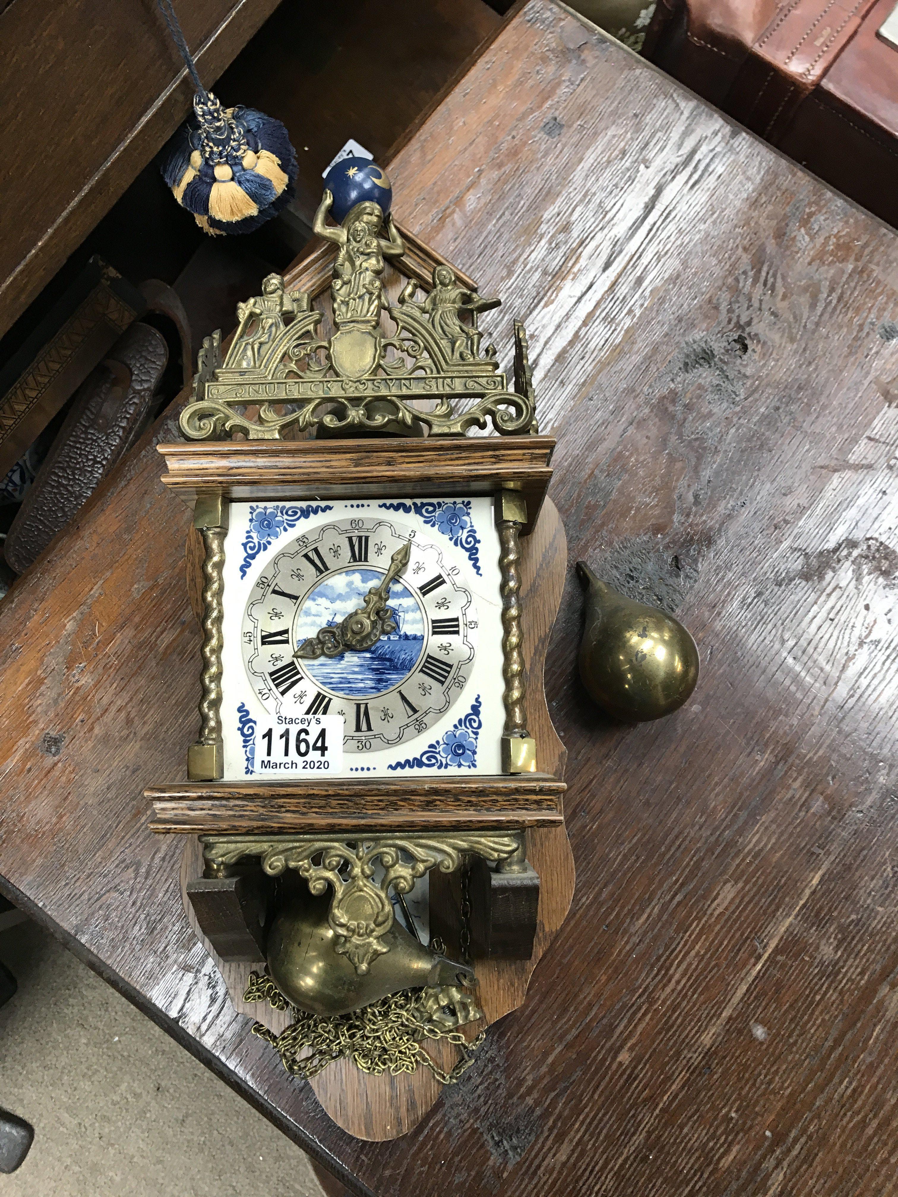 A Dutch delft and oak wall clock