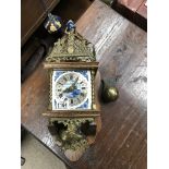 A Dutch delft and oak wall clock