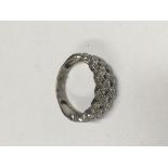 A 9ct white gold and diamond set weave ring.