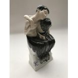 A Seated Satrys porcelain figurine by