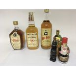 A collection of three bottles of whisky comprising a bottle of Stewart’s Dundee Whyte & Mackay and