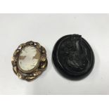 2 Victorian carved cameo brooches.