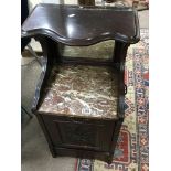 An Edwardian mahogany and marble coal box cabinet.