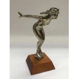 A car mascot of a nude Art Deco girl in a diving p