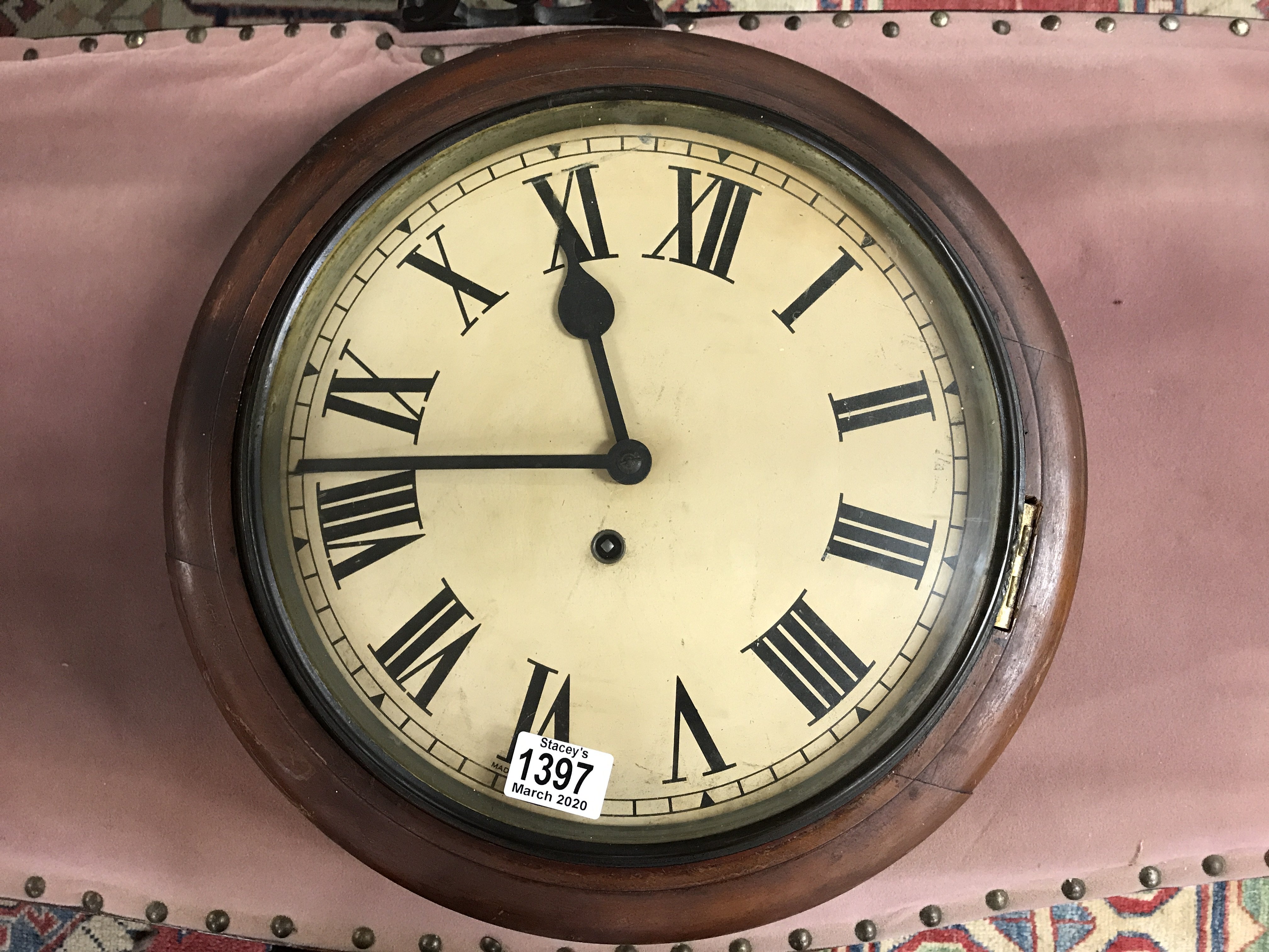 A Victorian circular wall clock.