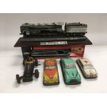 Four tin plate vehicles, pewter train and a boxed