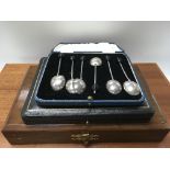 A cased set of Silver coffee spoons And cased flat