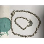A sterling silver necklace and bracelet marked Tif