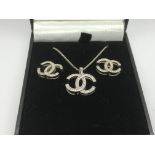 A pair of Gucci style silver earrings and a pendant on chain.