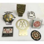 A group of vintage car badges including a Wrekin G