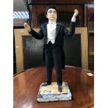 A handmade papier-mâché figure signed JM Westell 1961.