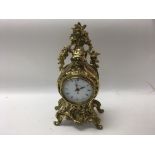 A 20th century brass mantle clock by Robert Grant of London with a quartz movement. Height approx