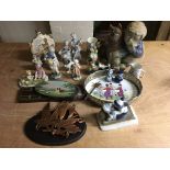 A collection of pottery and porcelain figures of children etc.