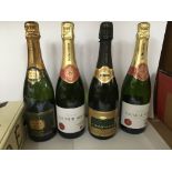 A collection of 9 bottles of brut and champagne including Mo‘t and the wine society.