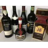 A collection of six bottles of wines and spirits